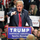 In this Oct. 29, 2015 file photo, Republican presidential candidate Donald Trump in Sparks, Nev. One year before Election Day 2016, Republicans are consumed by uncertainty and infighting while Democrats are coalescing behind Hillary Rodham Clinton. But there's a long way to go.
